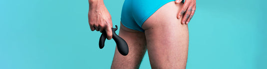 Butt Plugs Category Image Banner - Man holding butt plug by his bum