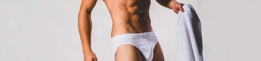 Briefs Collection Page Image - Man in briefs underwear holding a towel