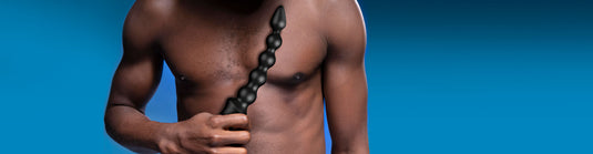 Vibrators Collection Page Image - Man holding a beaded anal vibrator