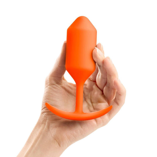 b-Vibe Snug Plug 3 Weighted Silicone Butt Plug Orange - Simply Pleasure